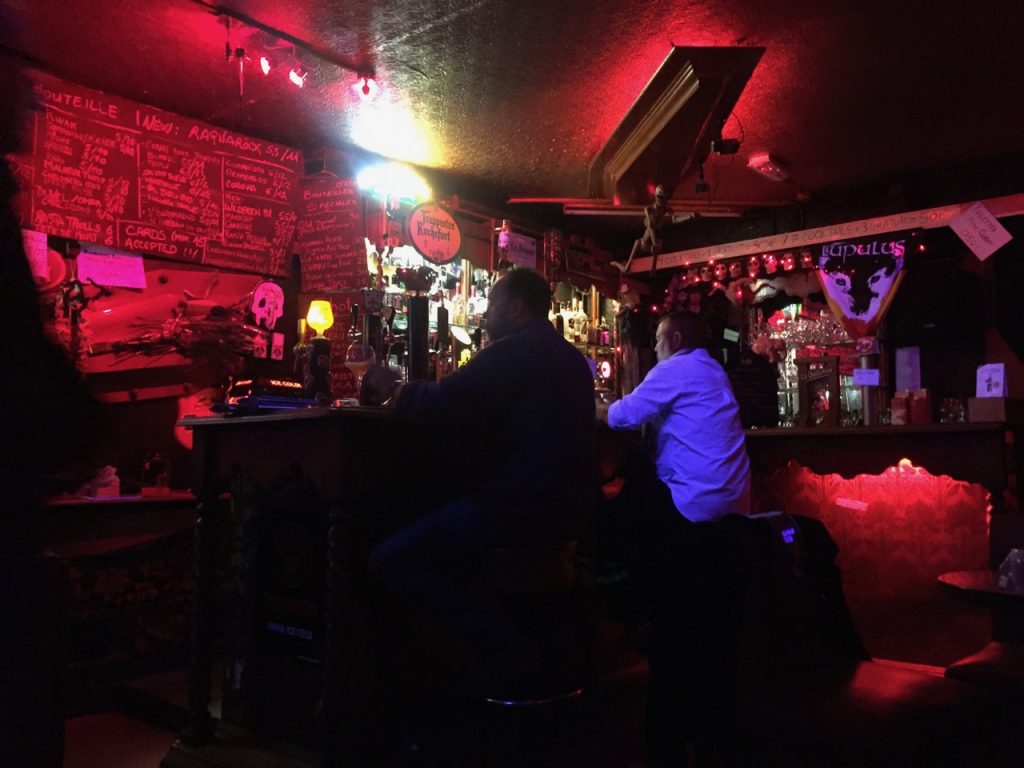 The bar with skulls as decoration and a coffin overhead